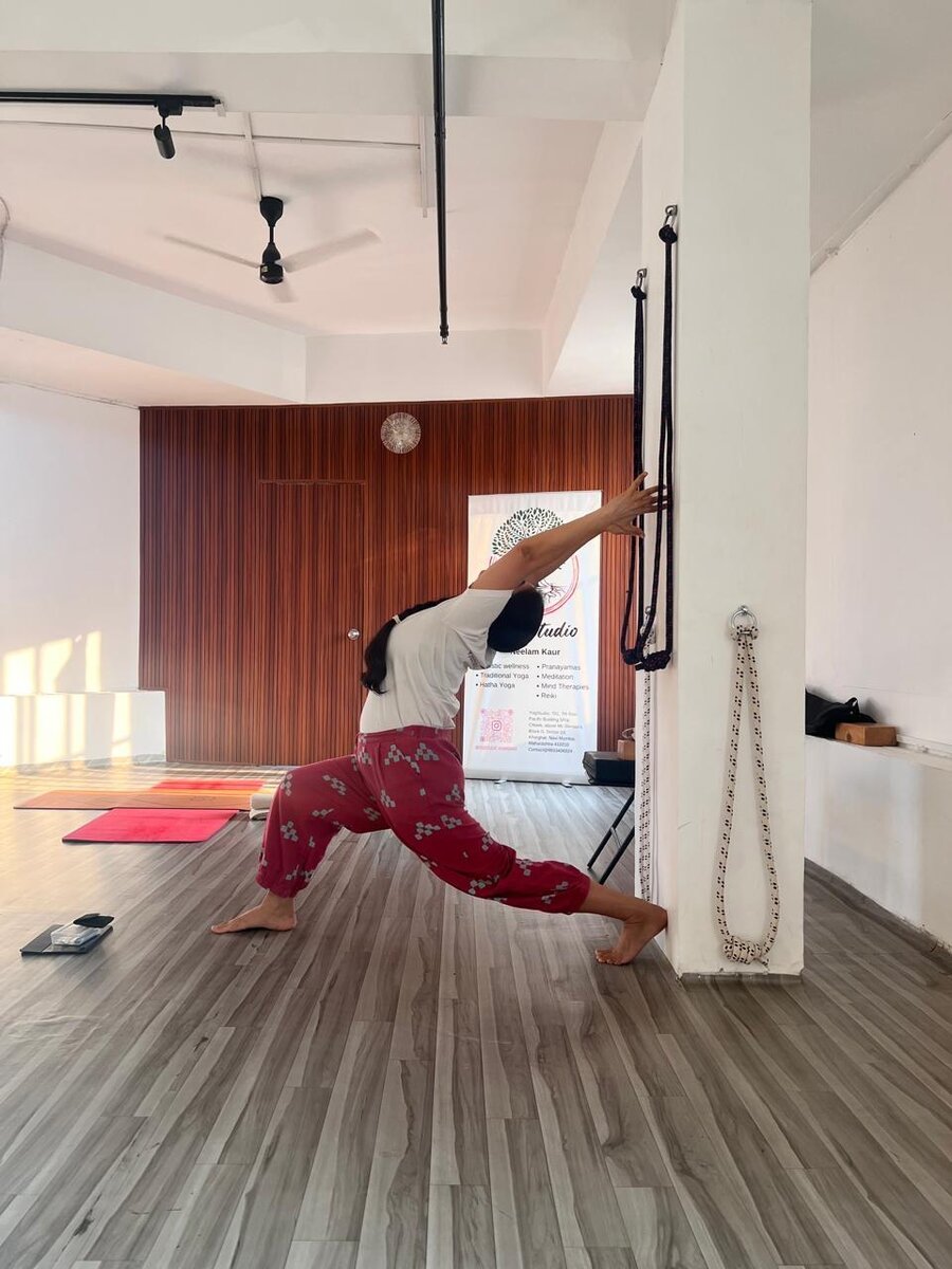 Yoga pose demonstration at YogStudio Kharghar
